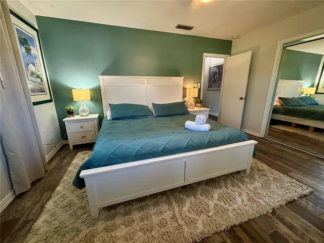 a living room with furniture and a mirror