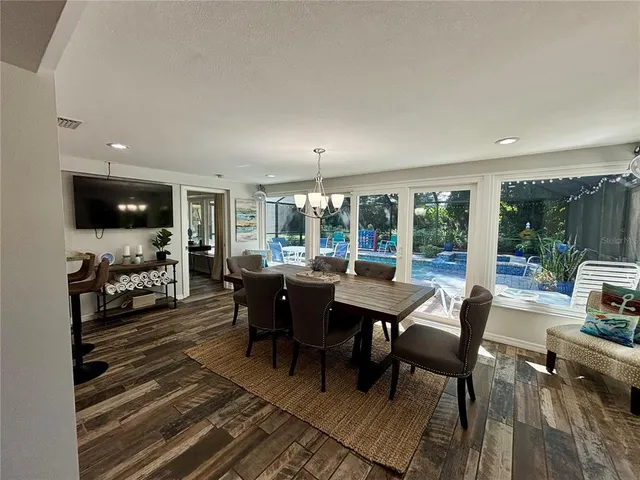 a view of a dining room with furniture window and outside view