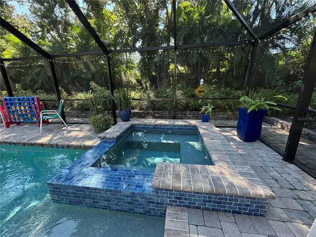 a view of a backyard with sitting area