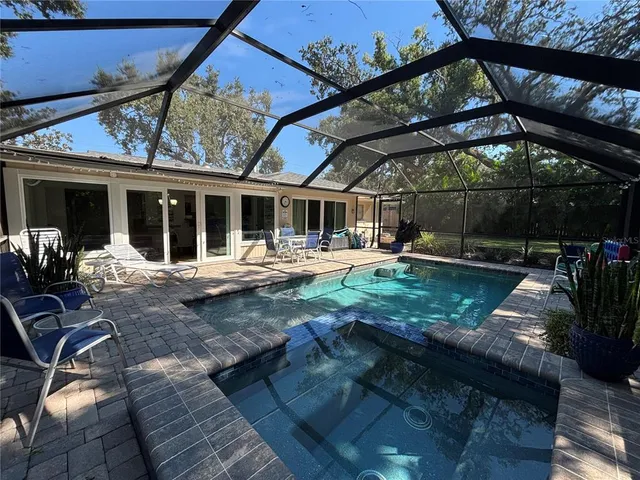 a backyard of a house with yard and outdoor seating