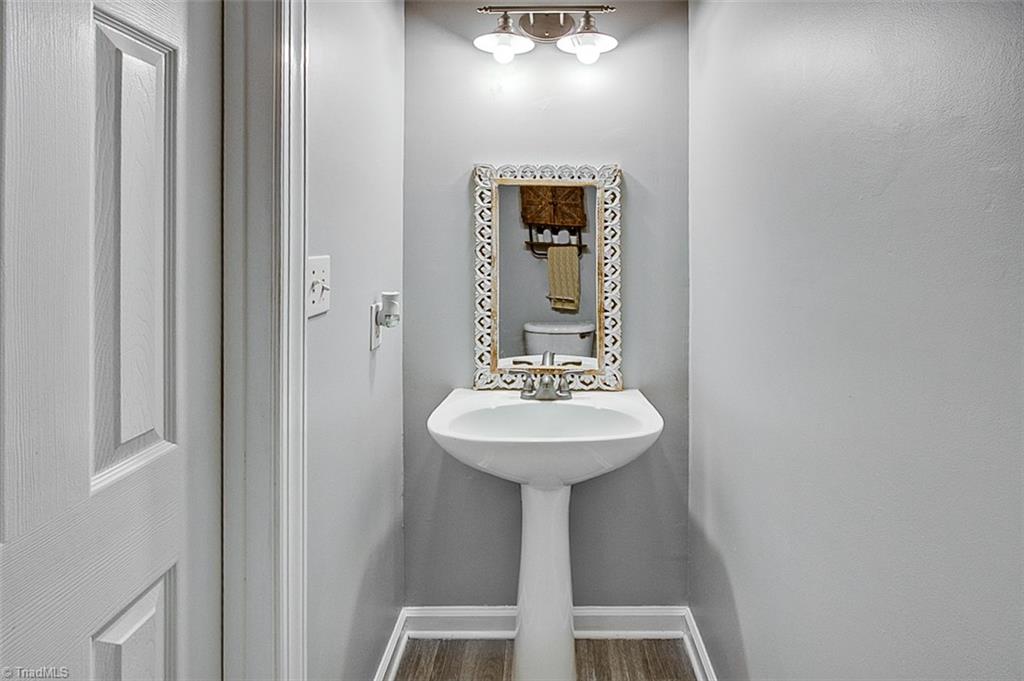 6103 Trotter Ridge Road Summerfield, NC 27358 - Photo 17 of 38 Powder room on main level