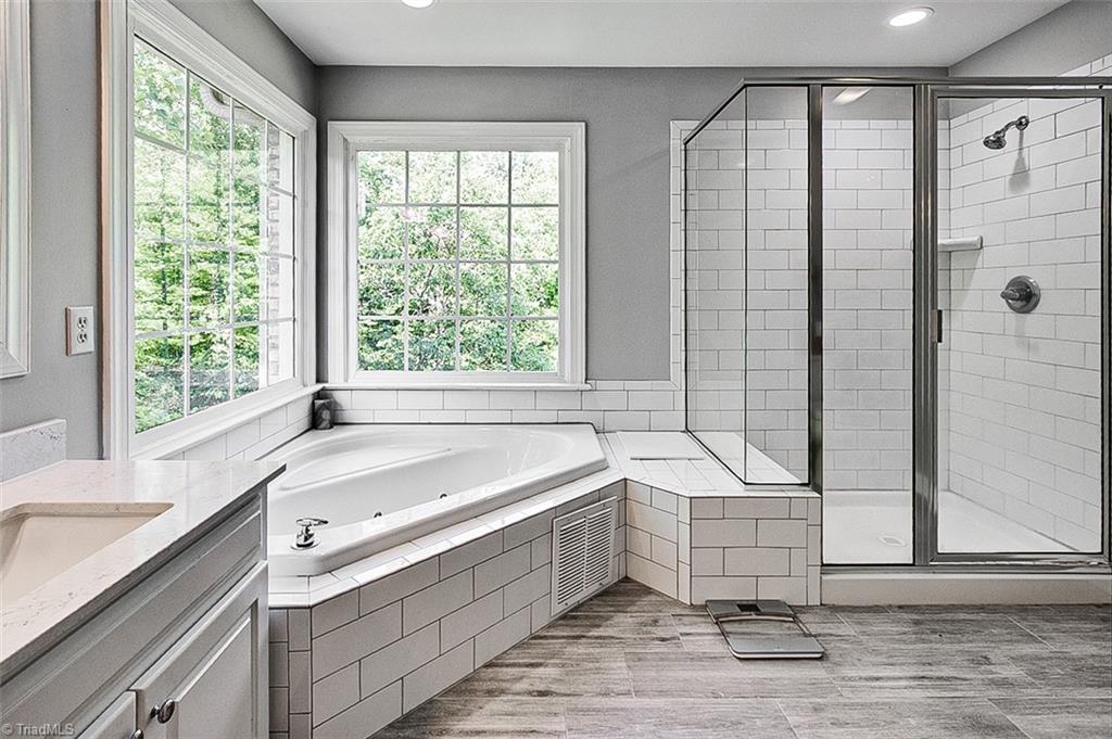 6103 Trotter Ridge Road Summerfield, NC 27358 - Photo 22 of 38 Primary en suite with jetted tub and walk-in shower