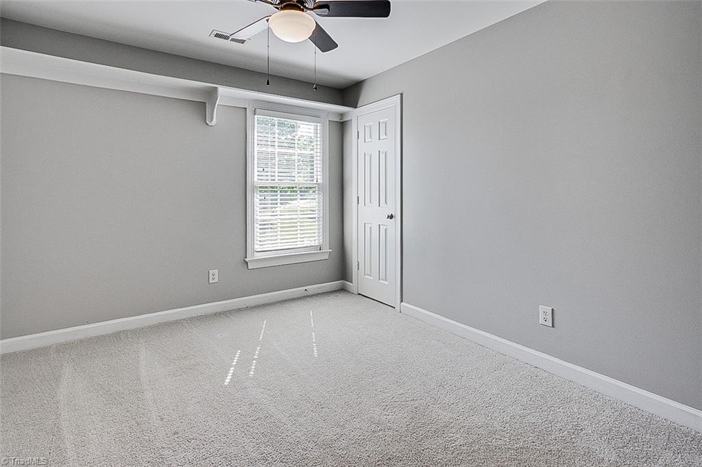 6103 Trotter Ridge Road Summerfield, NC 27358 - Photo 27 of 38 Bedroom 4 with walk-through to primary suite