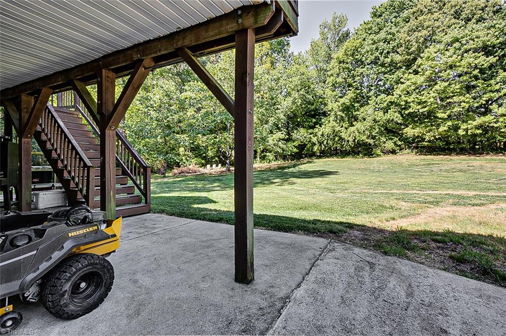 6103 Trotter Ridge Road Summerfield, NC 27358 - Photo 34 of 38 Covered porch looking out over beautiful backyard space