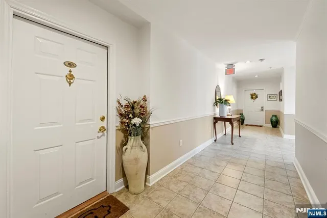 a living room with lots of furniture and a table
