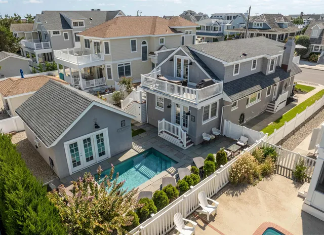 an aerial view of a house with a big yard