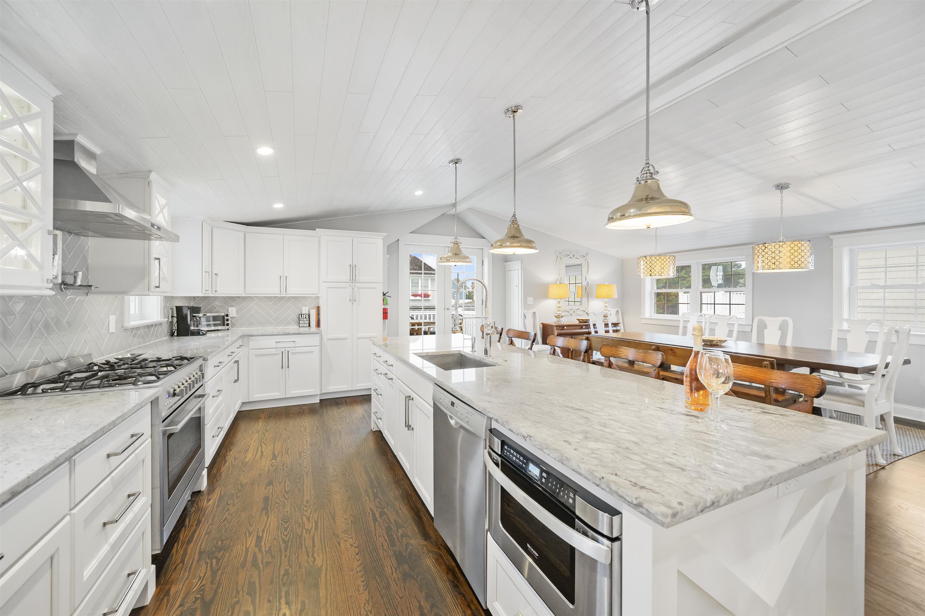 164 93rd Street Stone Harbor, NJ 08247 - Photo 34 of 47 a kitchen with stainless steel appliances granite countertop a sink a stove and a wooden floors