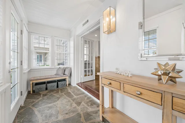 a spacious bathroom with a sink and a mirror