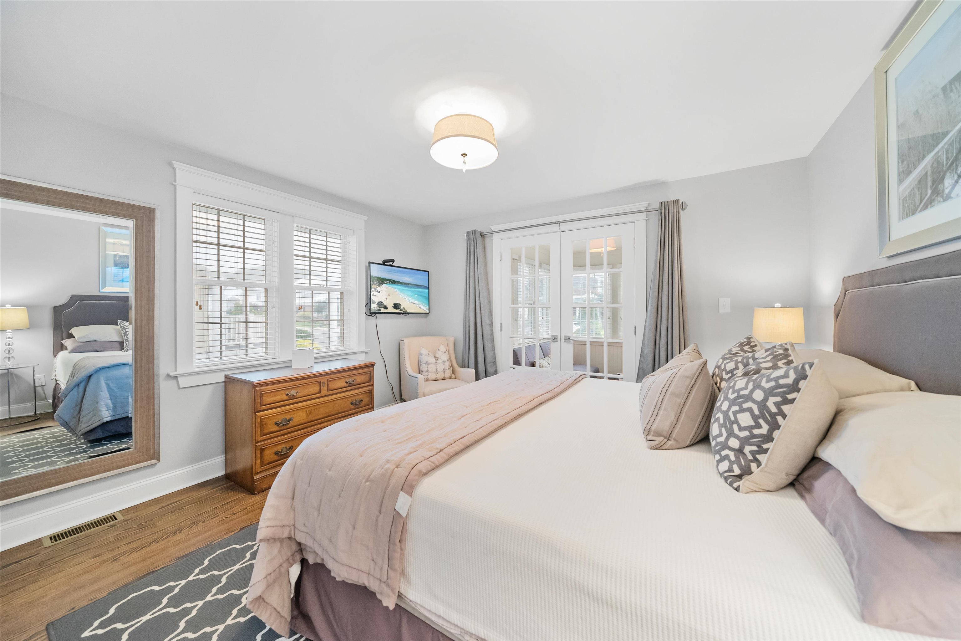 164 93rd Street Stone Harbor, NJ 08247 - Photo 9 of 47 a bedroom with a large bed and a large window