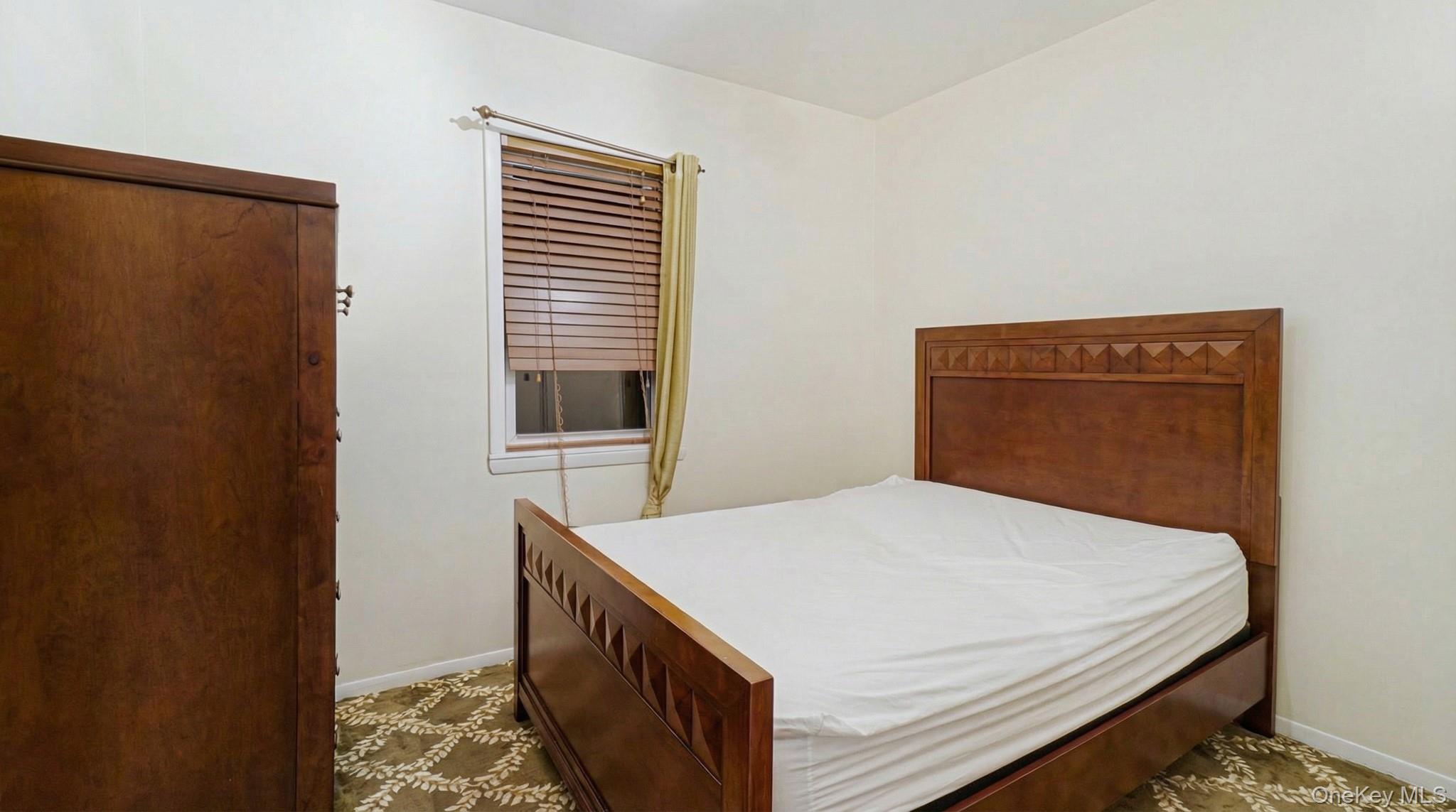 237-09 93rd Road Queens, NY 11426 - Photo 14 of 17 Bedroom with baseboards