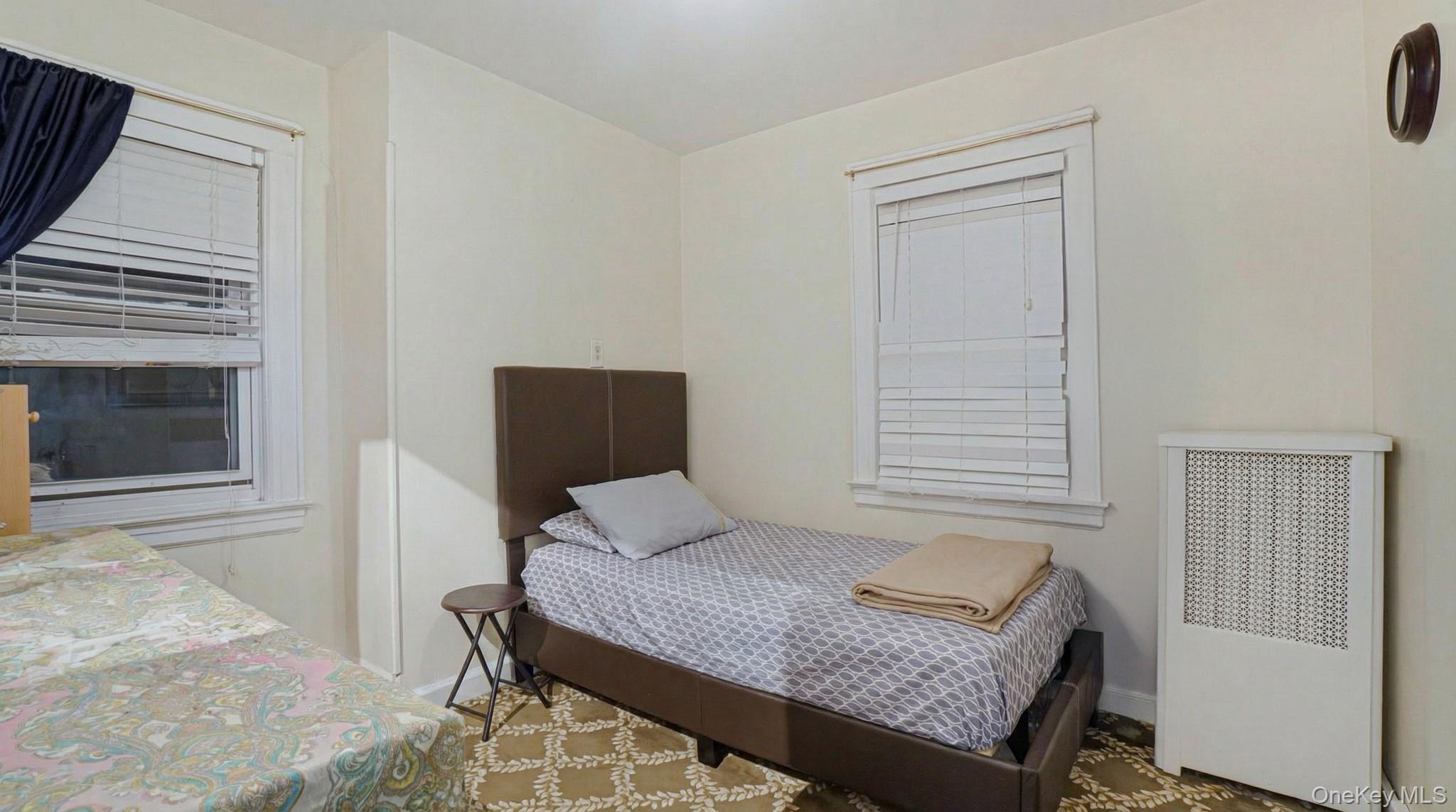 237-09 93rd Road Queens, NY 11426 - Photo 15 of 17 Bedroom with radiator