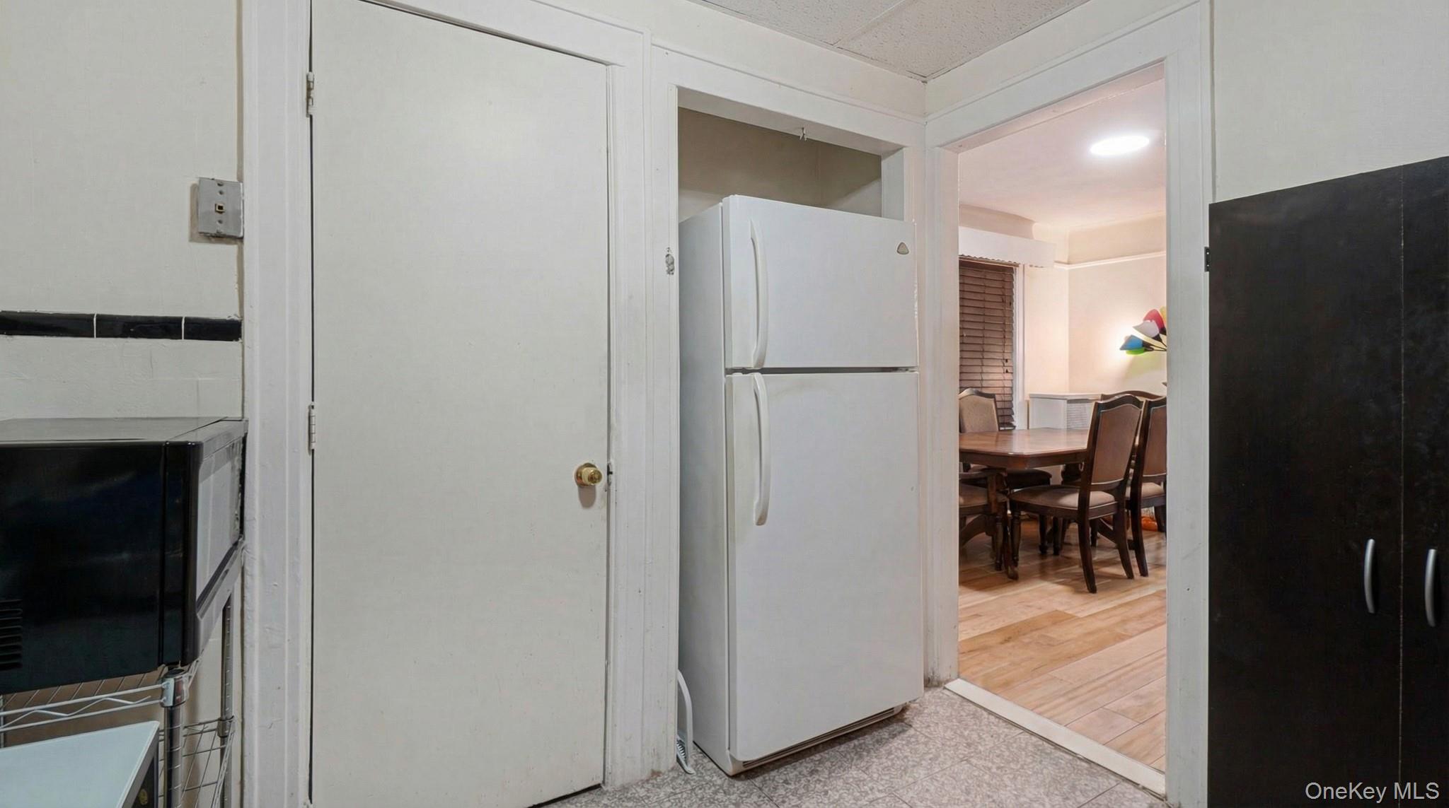 237-09 93rd Road Queens, NY 11426 - Photo 9 of 17 Kitchen with freestanding refrigerator