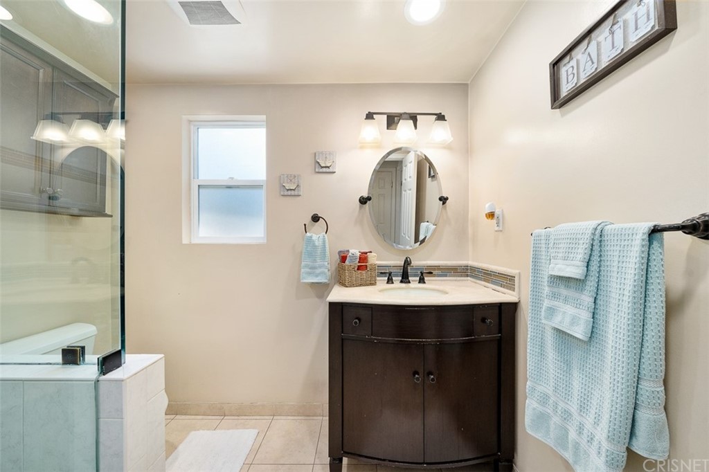 19454 Stagg Street Reseda, CA 91335 - Photo 16 of 39 Remodeled Bathroom 1 w/new family and walk in tile shower w/frameless door