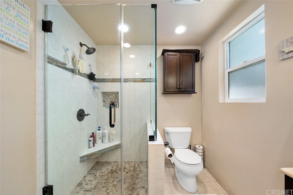 19454 Stagg Street Reseda, CA 91335 - Photo 17 of 39 Remodeled Bathroom 1 w/new family and walk in tile shower w/frameless door