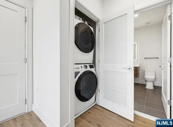 a utility room with sink dryer and washer