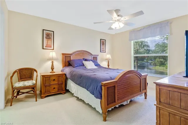 a bedroom with a bed and a chair