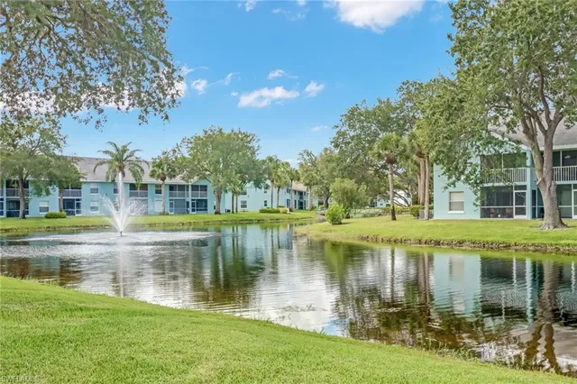 a view of a lake with a house in the background