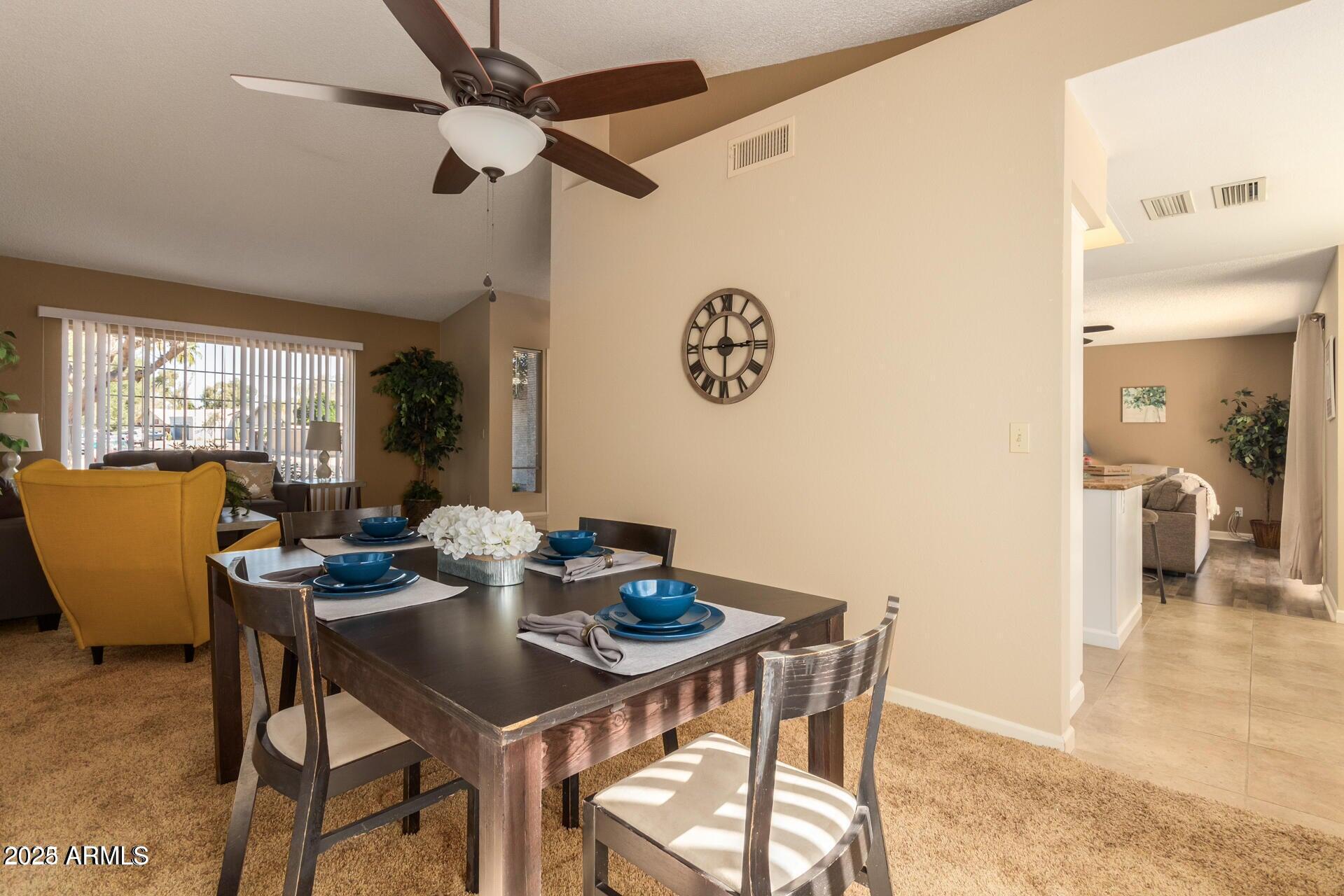 2221 West Rockwell Drive Chandler, AZ 85224 - Photo 6 of 14 a view of a dining room with furniture window and outside view