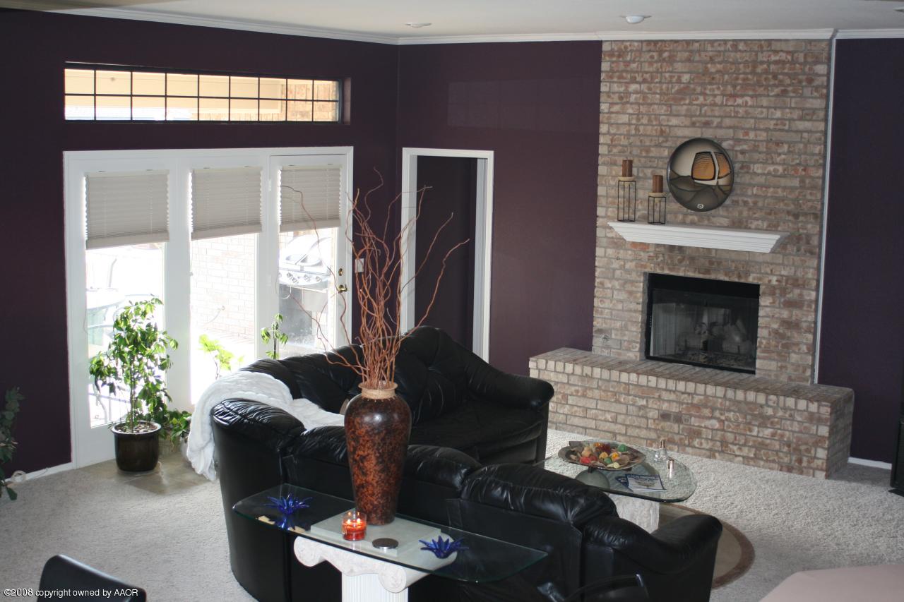 4201 Stepp Avenue Amarillo, TX 79110 - Photo 2 of 7 a living room with furniture and a fireplace