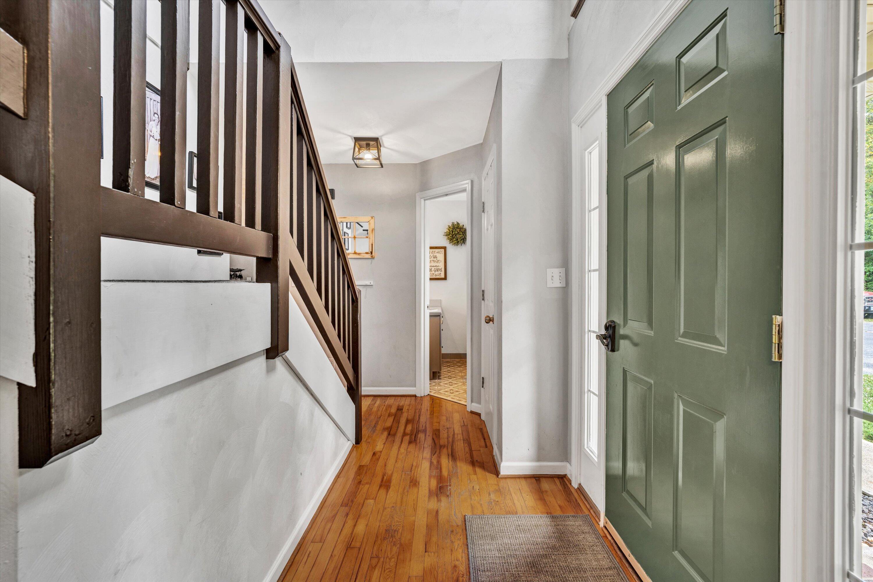 140 Charlie Road Hardy, VA 24101 - Photo 4 of 33 a view of a hallway with wooden floor and staircase