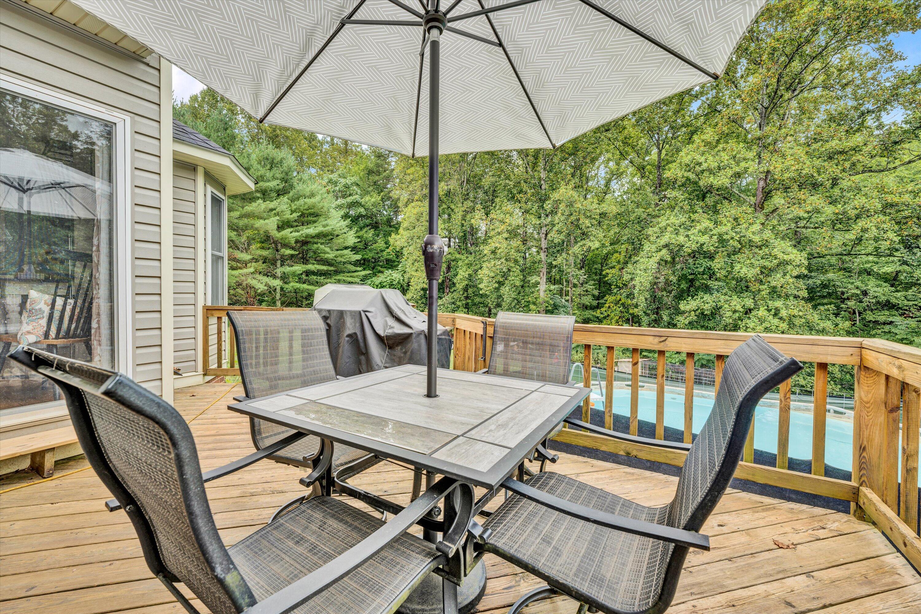 140 Charlie Road Hardy, VA 24101 - Photo 5 of 33 a view of balcony with furniture and umbrella