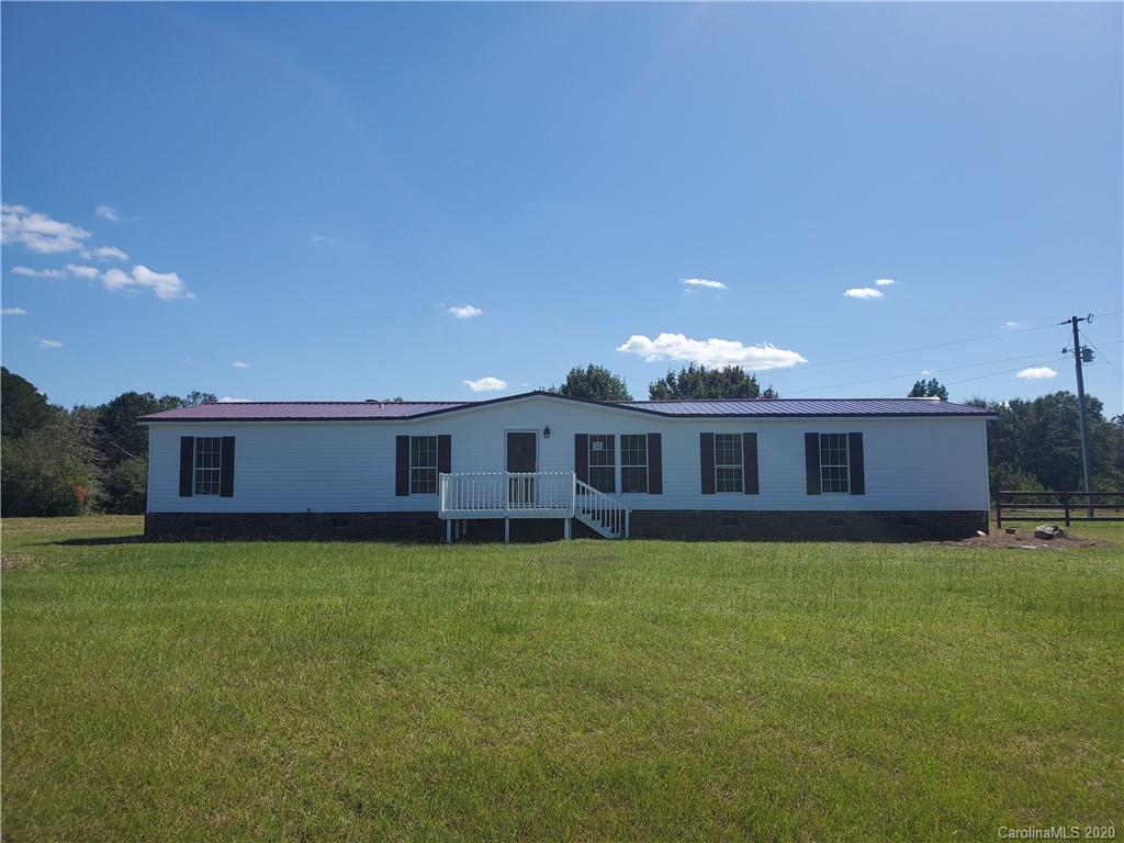 1282 Macedonia-Angelus Road Jefferson, SC 29718 - Photo 1 of 26 a view of a house with a yard and a patio