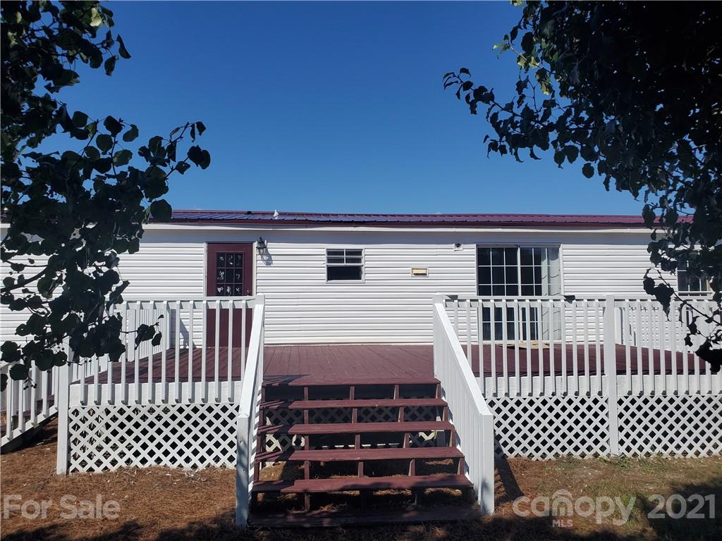 1282 Macedonia-Angelus Road Jefferson, SC 29718 - Photo 2 of 26 a view of a house with a small yard
