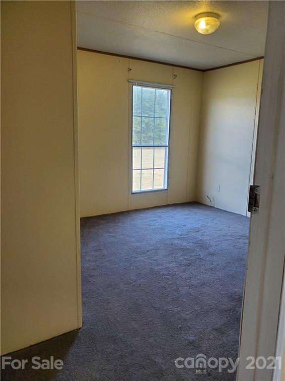 1282 Macedonia-Angelus Road Jefferson, SC 29718 - Photo 17 of 26 an empty room with windows