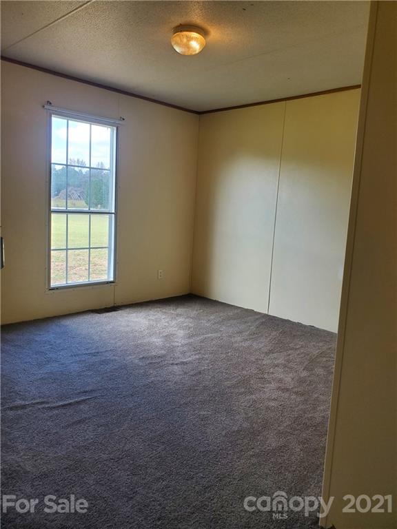 1282 Macedonia-Angelus Road Jefferson, SC 29718 - Photo 18 of 26 an empty room with a empty space and a window