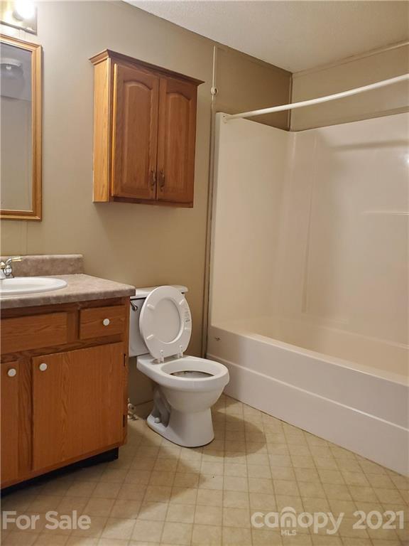 1282 Macedonia-Angelus Road Jefferson, SC 29718 - Photo 19 of 26 a bathroom with a sink a toilet and shower