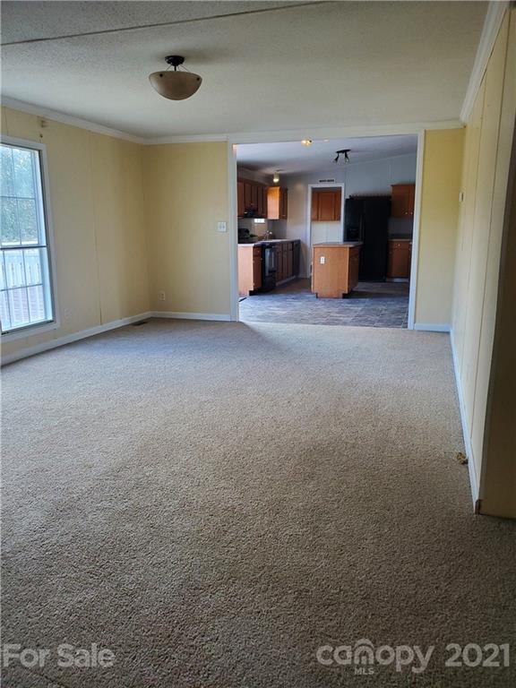 1282 Macedonia-Angelus Road Jefferson, SC 29718 - Photo 21 of 26 a view of a livingroom with furniture and a window