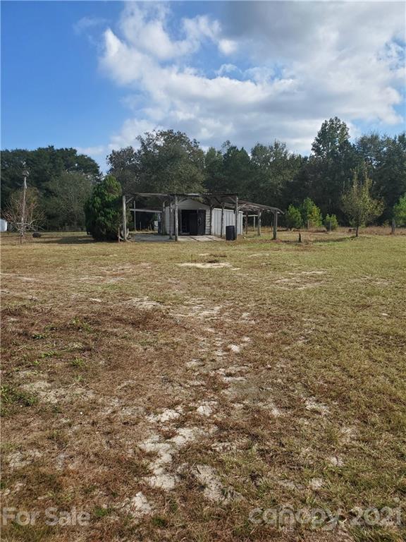 1282 Macedonia-Angelus Road Jefferson, SC 29718 - Photo 23 of 26 a front view of a house with a yard