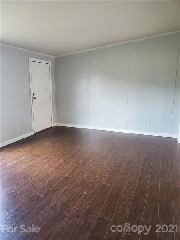 1282 Macedonia-Angelus Road Jefferson, SC 29718 - Photo 6 of 26 a view of an empty room with wooden floor