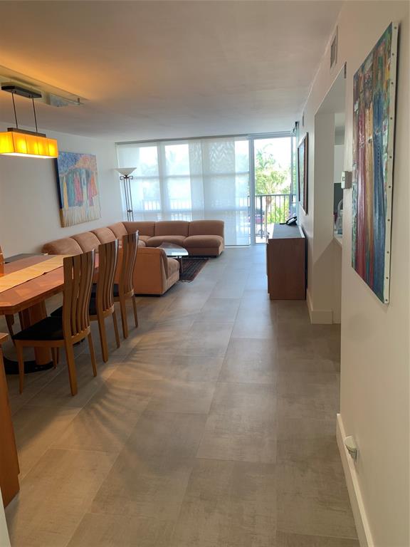 1000 Parkview Drive, Unit 319 Hallandale Beach, FL 33009 - Photo 11 of 16 a living room with furniture and a window