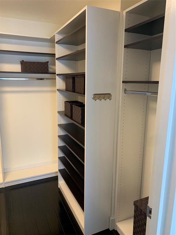 1000 Parkview Drive, Unit 319 Hallandale Beach, FL 33009 - Photo 13 of 16 a view of walk in closet with empty racks