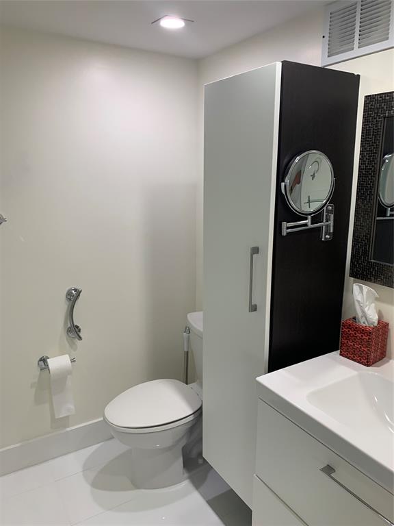 1000 Parkview Drive, Unit 319 Hallandale Beach, FL 33009 - Photo 16 of 16 a bathroom with a toilet and a sink
