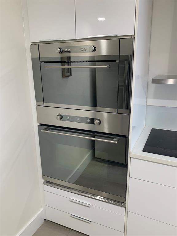 1000 Parkview Drive, Unit 319 Hallandale Beach, FL 33009 - Photo 7 of 16 a close view of washer and dryer