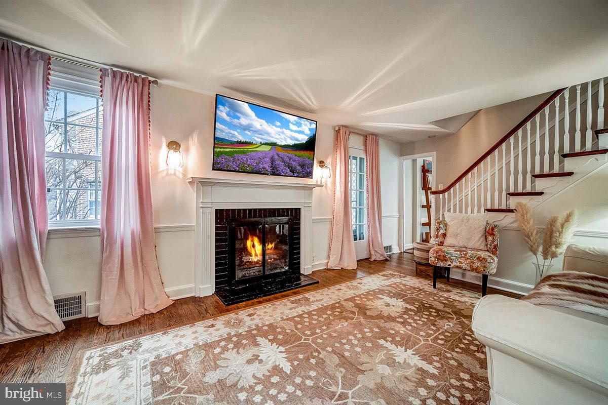433 Laverock Road Glenside, PA 19038 - Photo 4 of 27 Living Room Fireplace with doors to covered patio