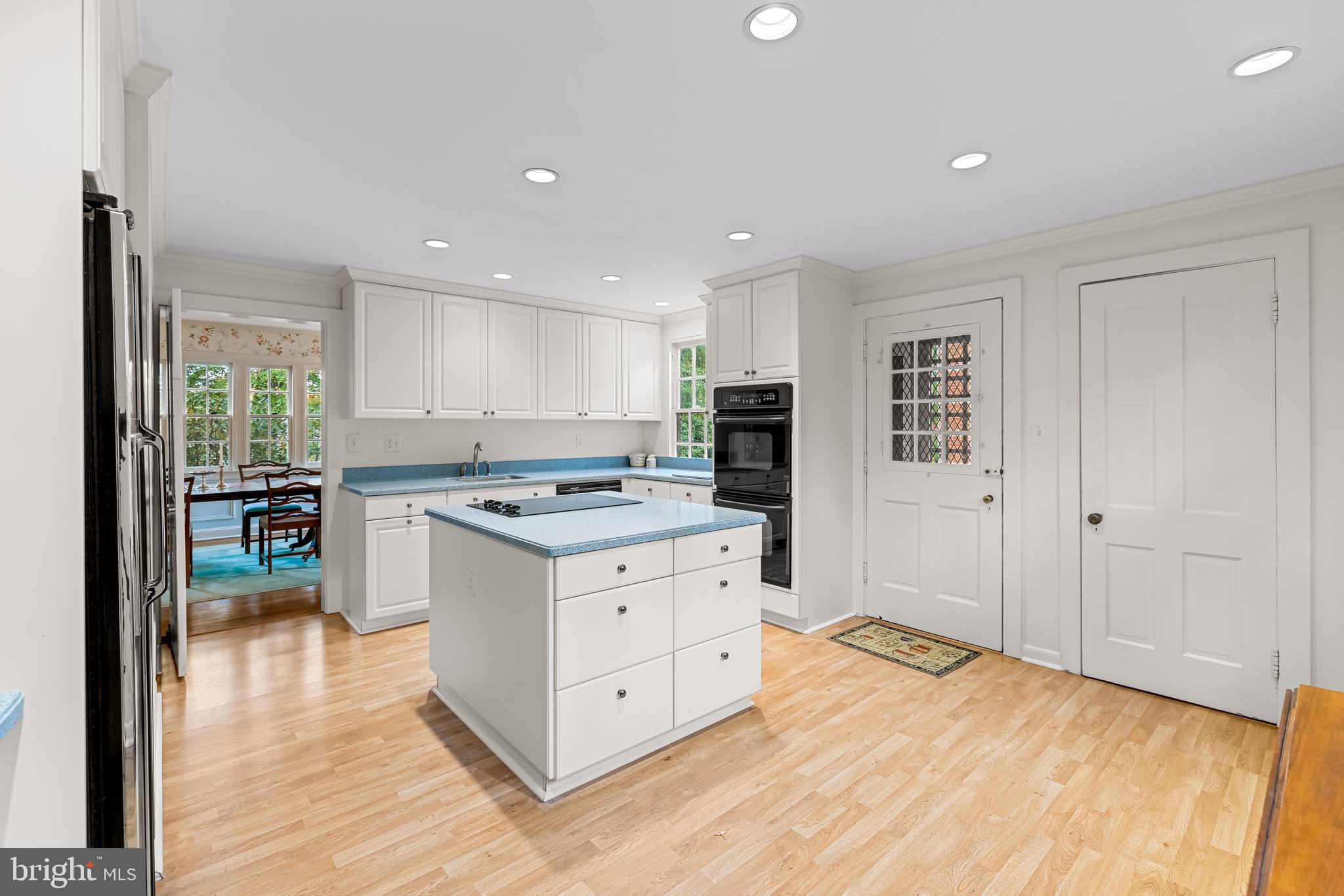 308 Northfield Place Baltimore, MD 21210 - Photo 12 of 41 a kitchen with stainless steel appliances kitchen island granite countertop a stove a sink and a refrigerator