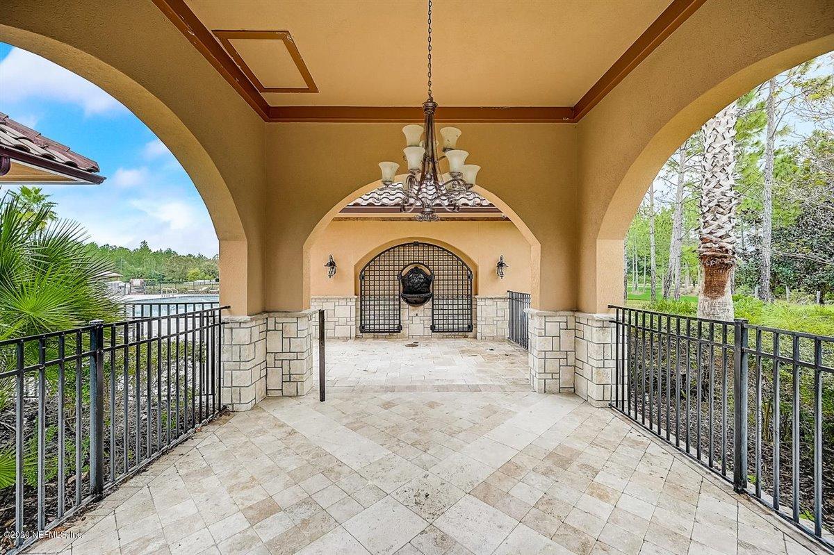 96 Enrede Lane St. Augustine, FL 32095 - Photo 54 of 64 a view of a fireplace and potted plants