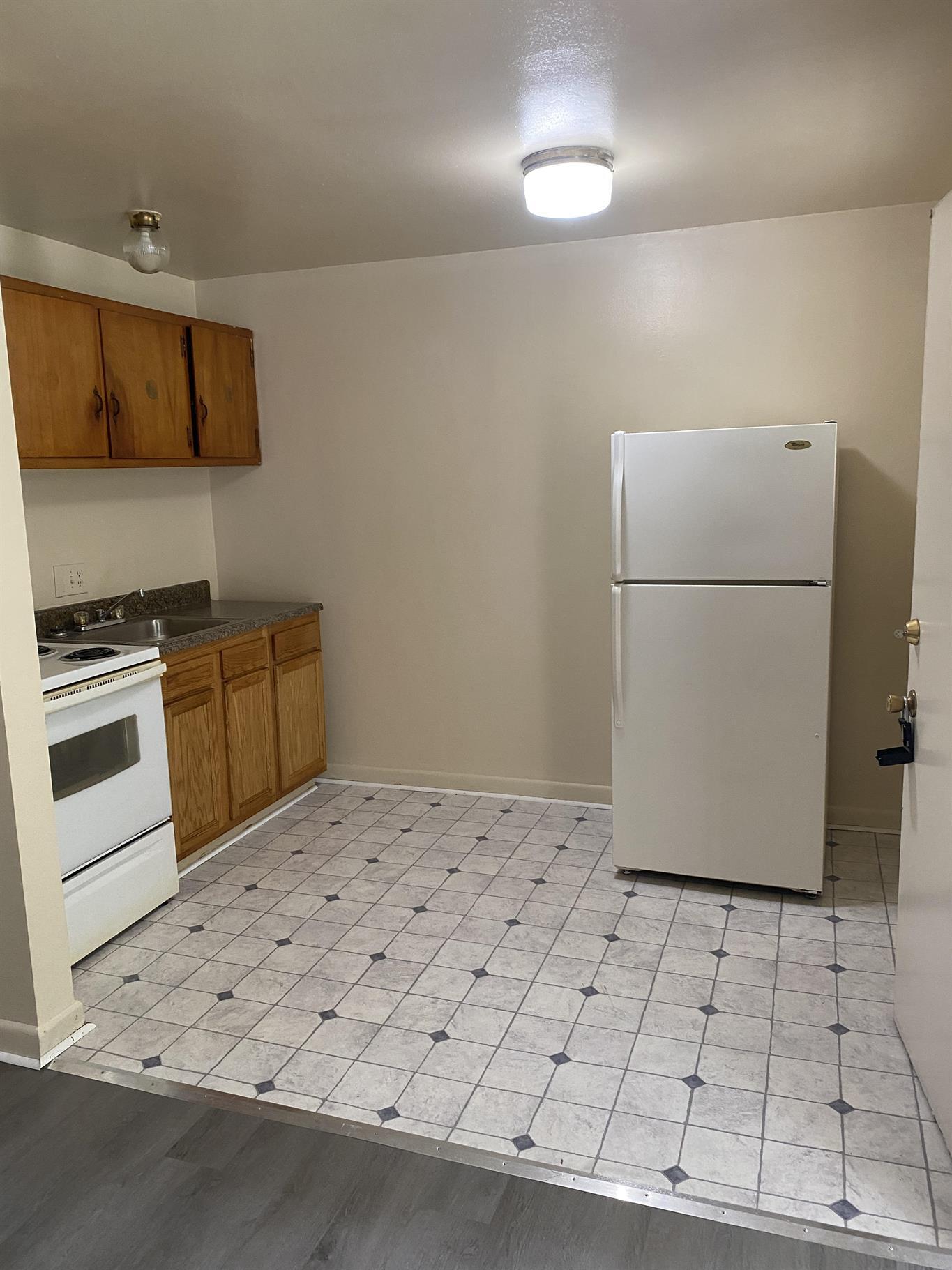 200 Ridgeview Lane, Unit 53 Bassett, VA 24055 - Photo 8 of 10 a kitchen with a refrigerator and a stove