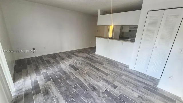 a view of a kitchen from the hallway