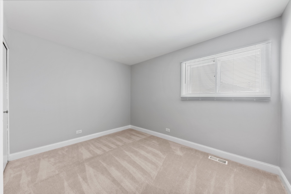 1681 Queensbury Circle Hoffman Estates, IL 60169 - Photo 11 of 13 a view of a room that has a window in it