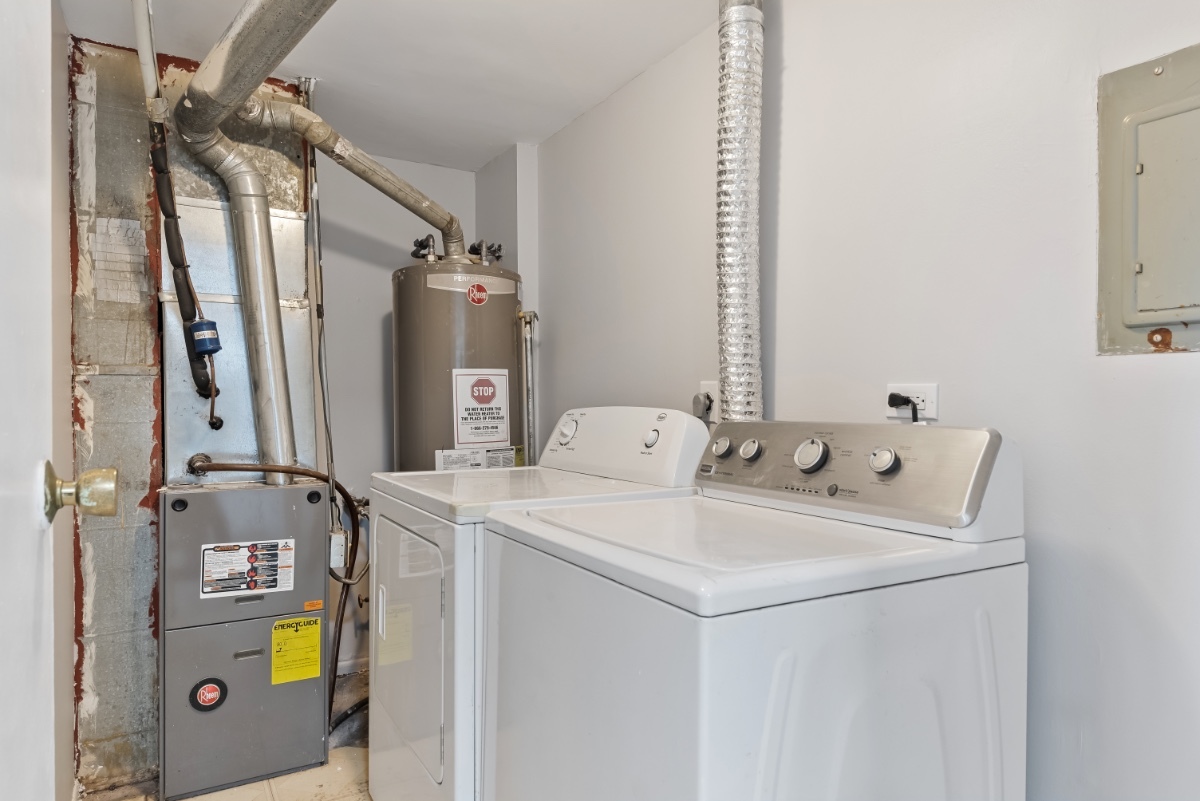 1681 Queensbury Circle Hoffman Estates, IL 60169 - Photo 12 of 13 a utility room with dryer and washer
