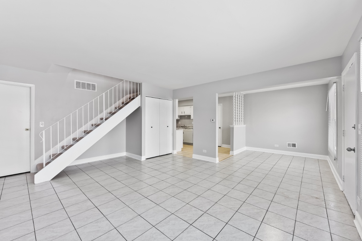 1681 Queensbury Circle Hoffman Estates, IL 60169 - Photo 2 of 13 a view of an empty room with stairs