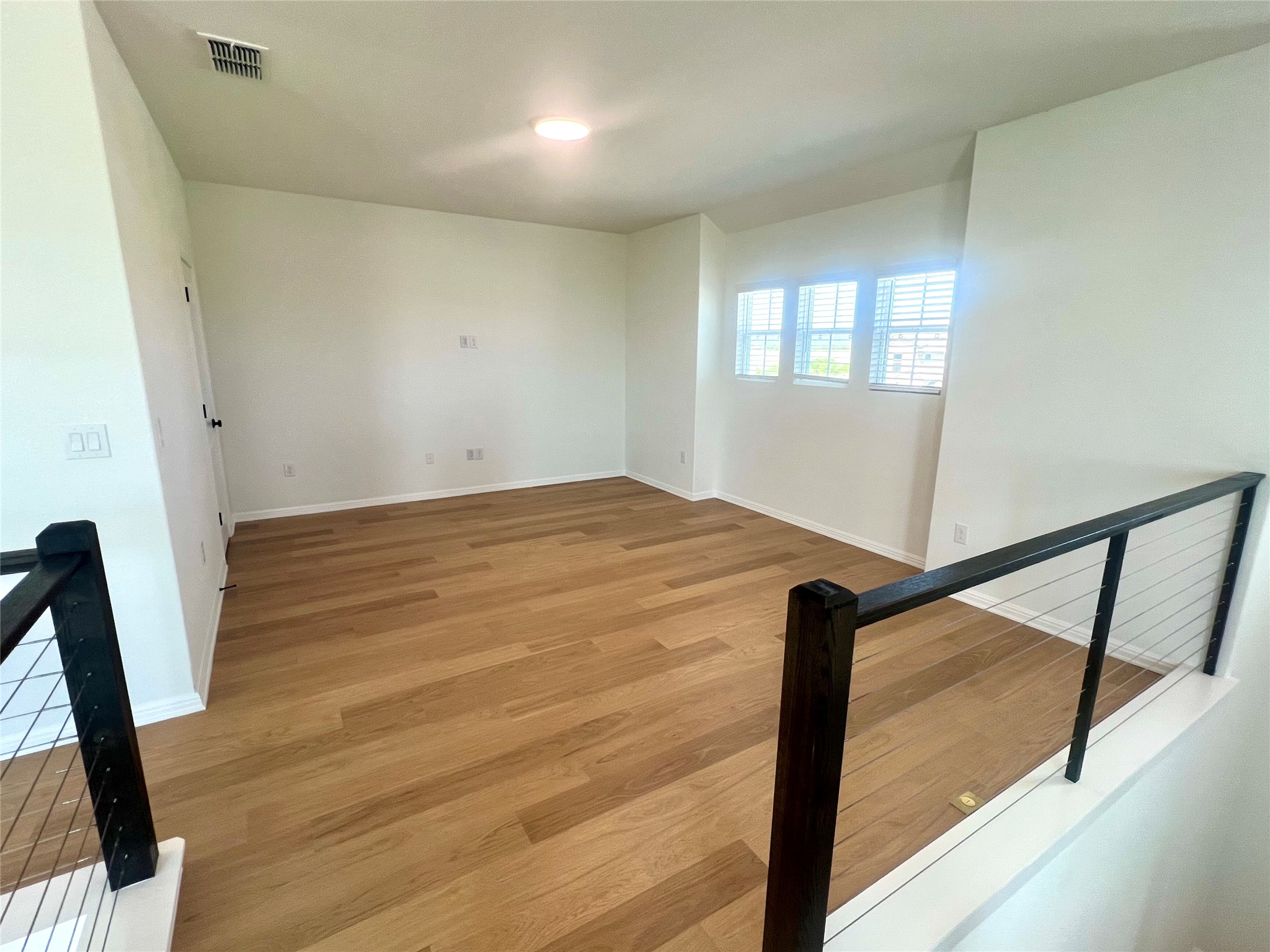 365 Young Street Buda, TX 78610 - Photo 15 of 27 a view of an empty room and window