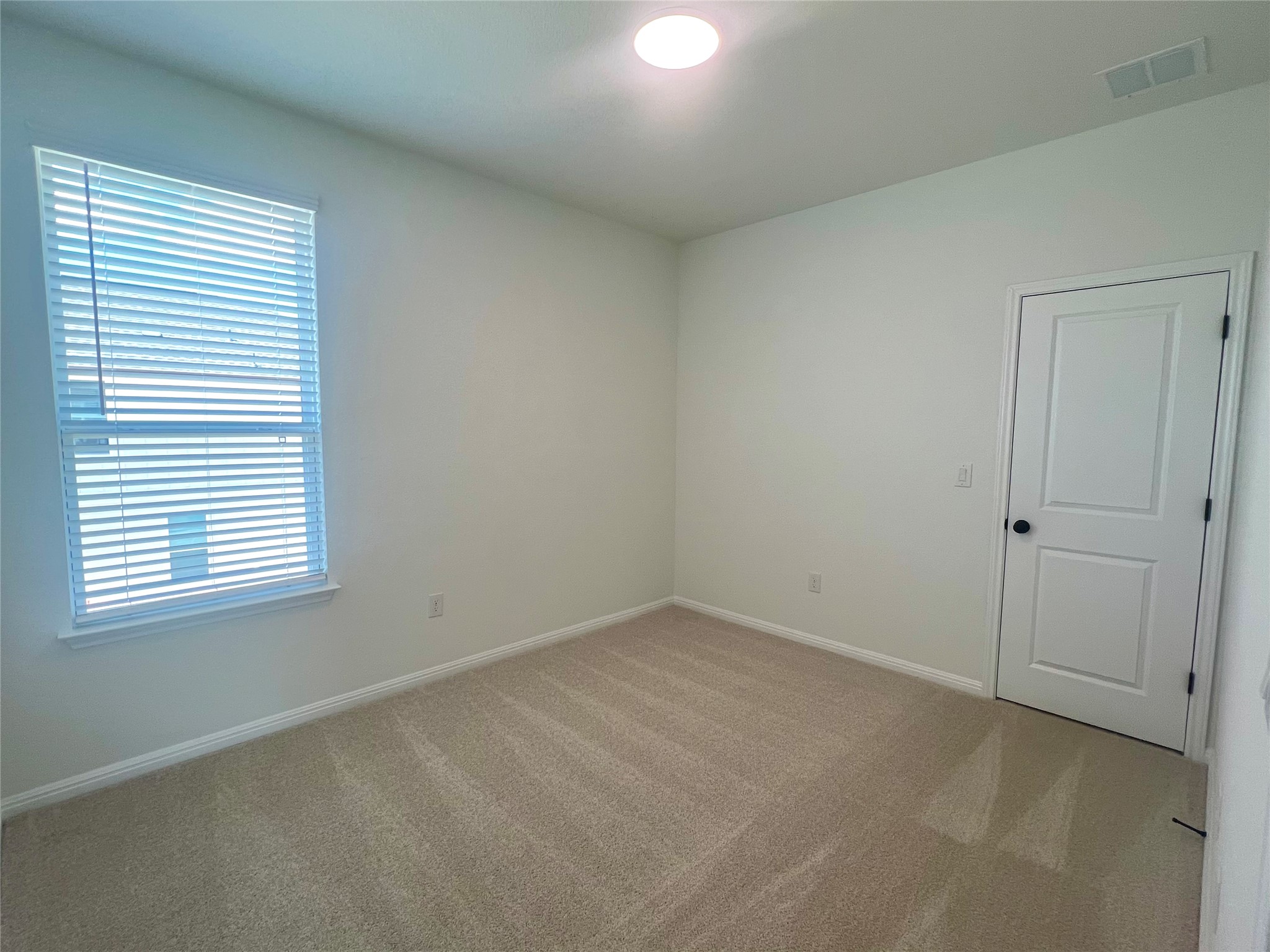 365 Young Street Buda, TX 78610 - Photo 16 of 27 an empty room with a window