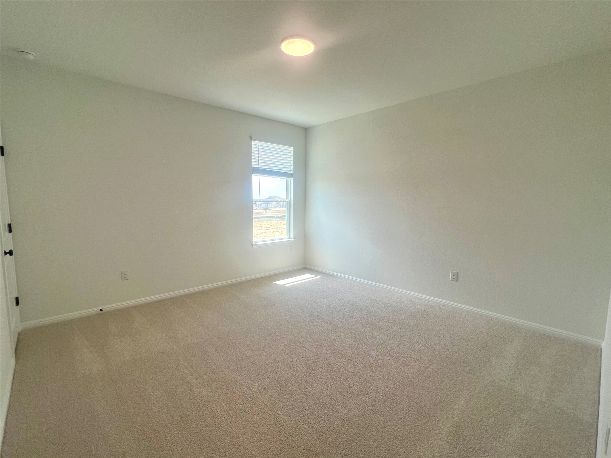 365 Young Street Buda, TX 78610 - Photo 18 of 27 an empty room with windows