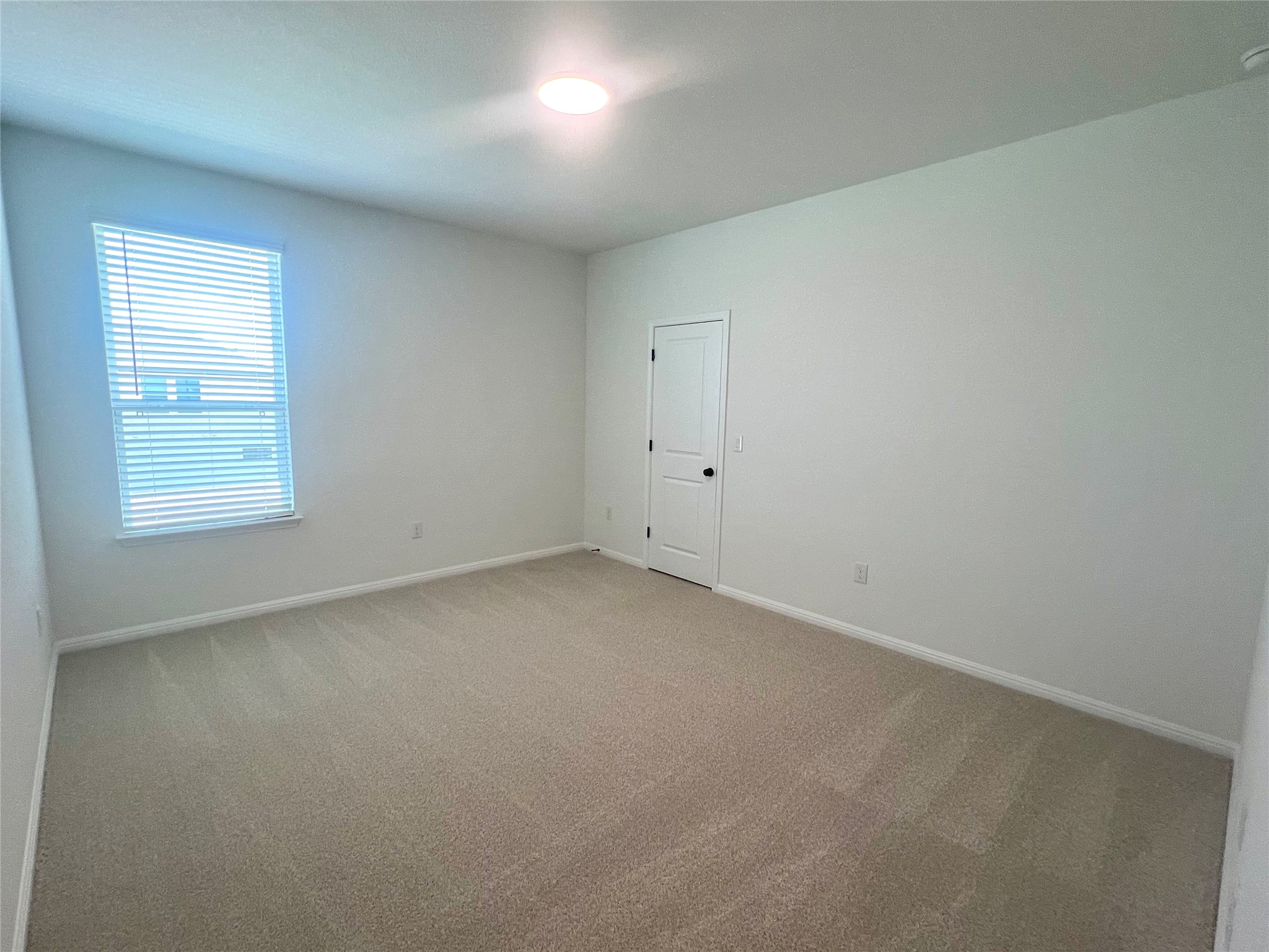 365 Young Street Buda, TX 78610 - Photo 19 of 27 an empty room with a window