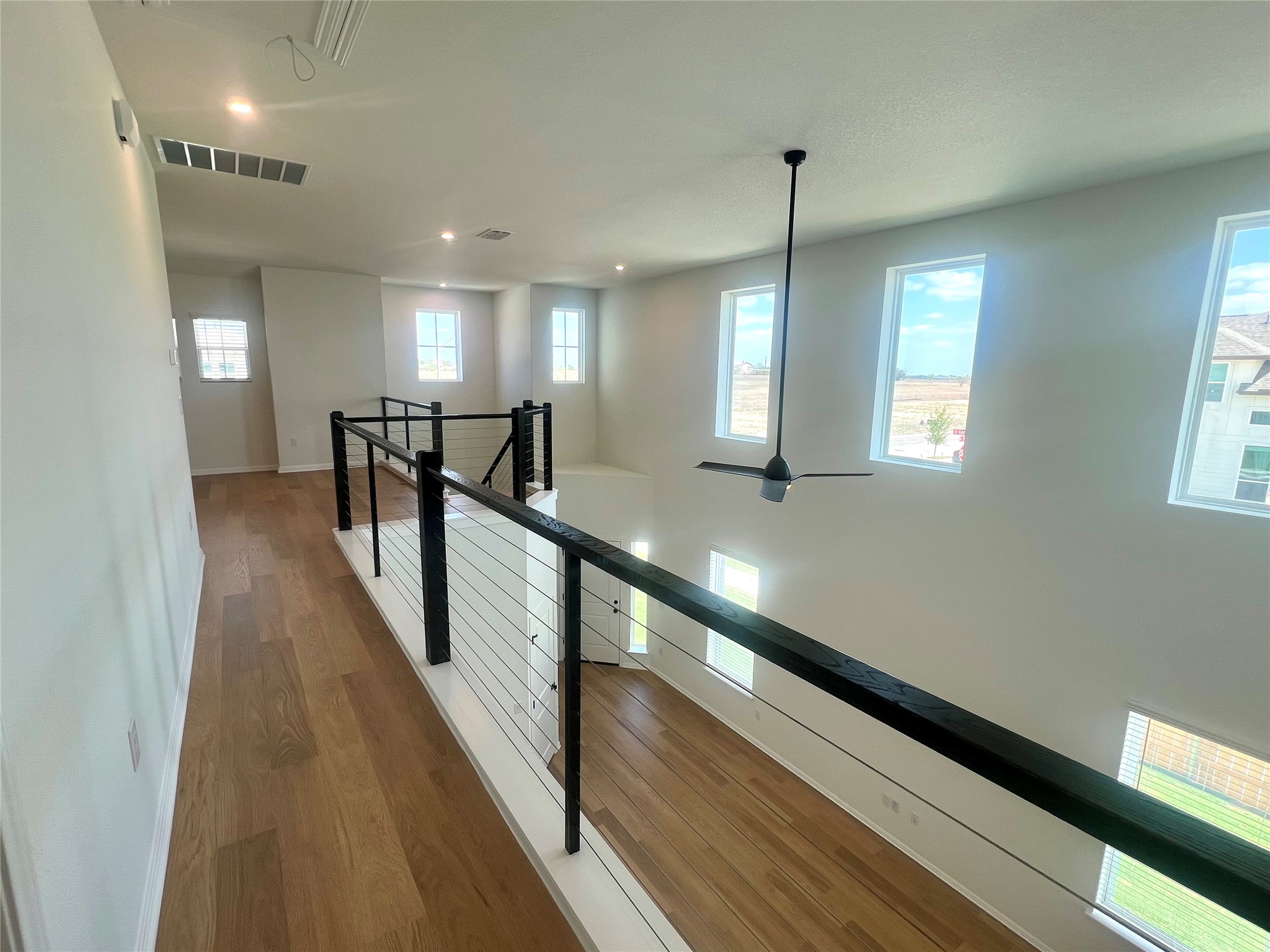 365 Young Street Buda, TX 78610 - Photo 20 of 27 a view of entryway and hall with wooden floor